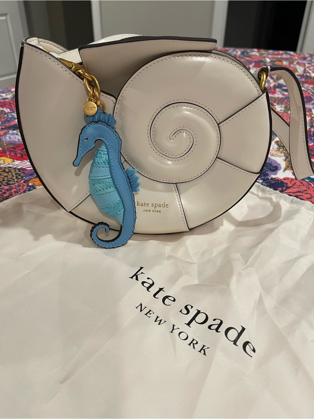 kate spade Cream Nautilus Shell Crossbody with Blue Seahorse Charm